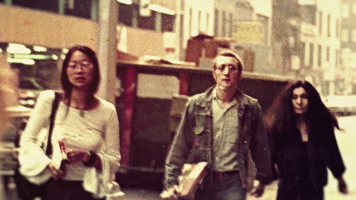 May Pang, John Lennon, and Yoko Ono walking in New York City