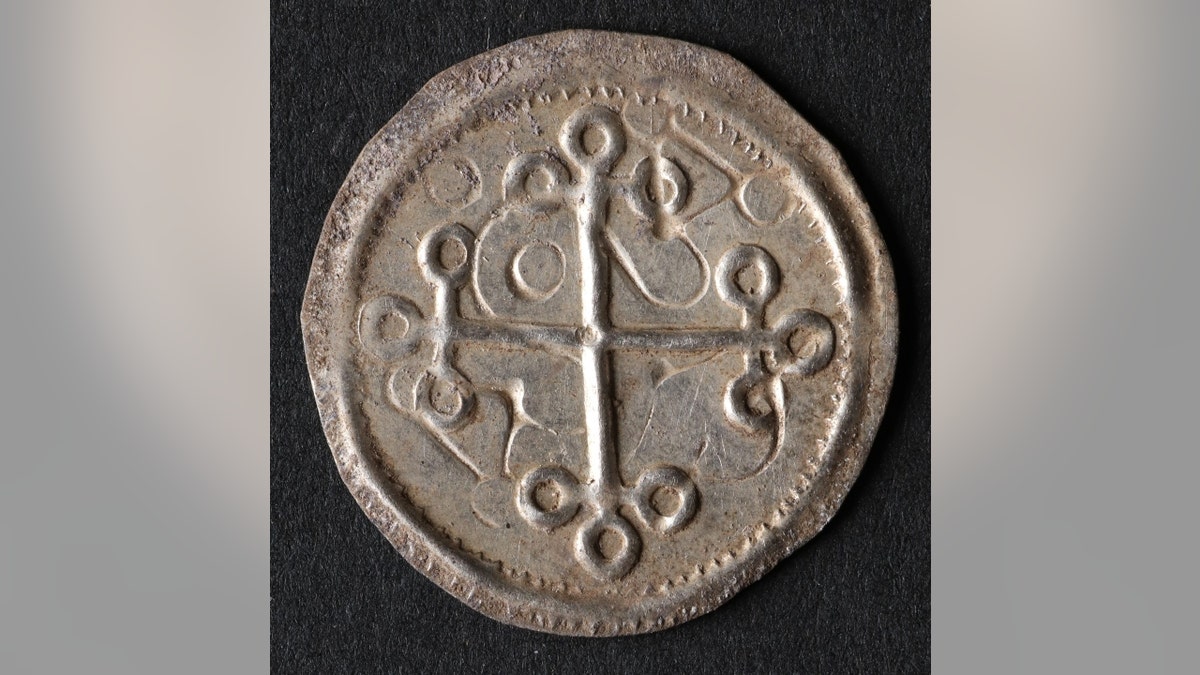 A cross coin