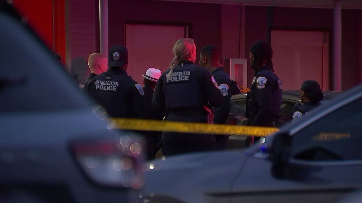 Police outside of the Ivy City Hotel.