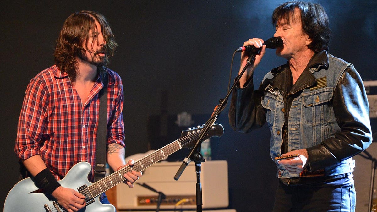 Dave Grohl and Lee Ving performing together on stage