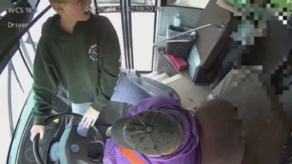 Dillon Reeves is seen telling other students to call 911 to help the Warren Consolidated Schools bus driver.