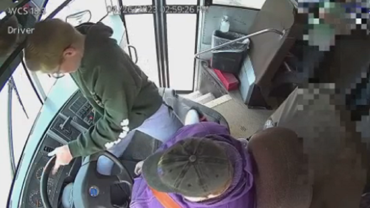 Dillon Reeves is seen grabbing the steering wheel of the bus on Wednesday, April 26, in Warren, Michigan.