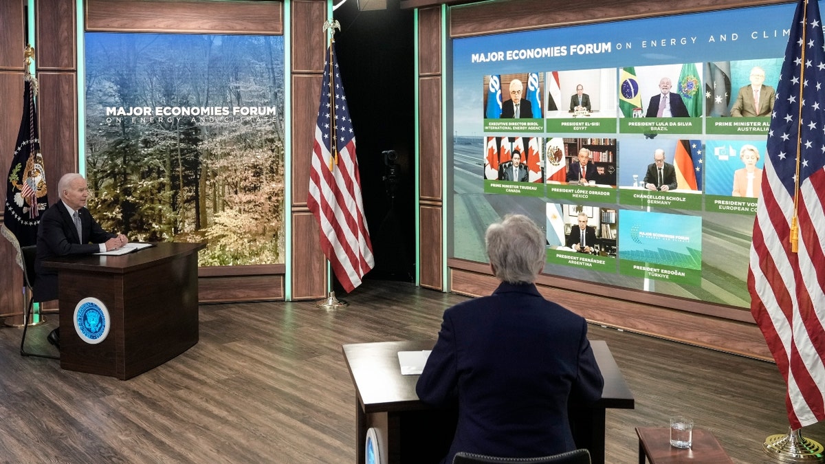 President Joe Biden and Special Presidential Envoy for Climate John Kerry participate in a virtual meetin