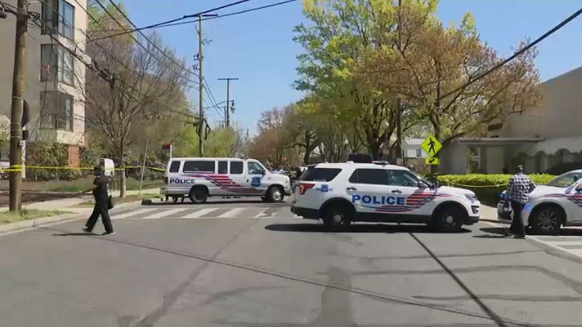 Law enforcement parked in front of the funeral.