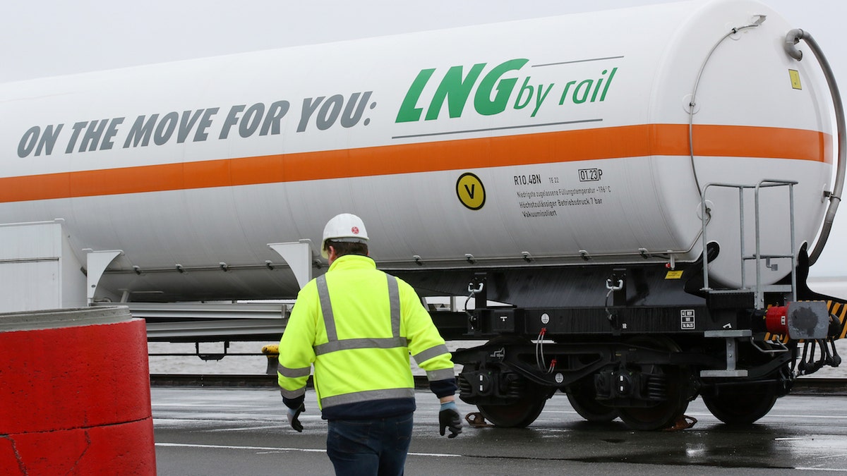 A tank car written with 'On the move for you: LNG by rail' can be seen before loading at the Elbehafen port in Brunsbuettel, Germany, 25 April 2016. 25 April 2016 will be the first time that a tank car is filled with liquified natural gas (LNG) and the Elbehafen port in Brunsbuettel. Photo: BODO MARKS/dpa | usage worldwide (Photo by Bodo Marks/picture alliance via Getty Images)