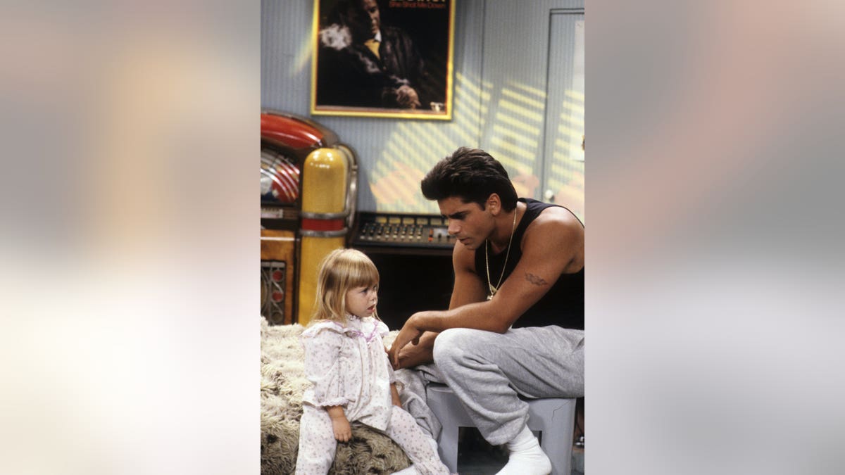 Olsen twin John Stamos on Full House set