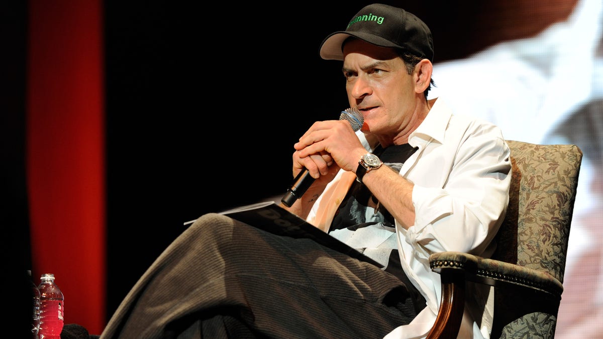 Charlie Sheen wears a #winning hat on stage