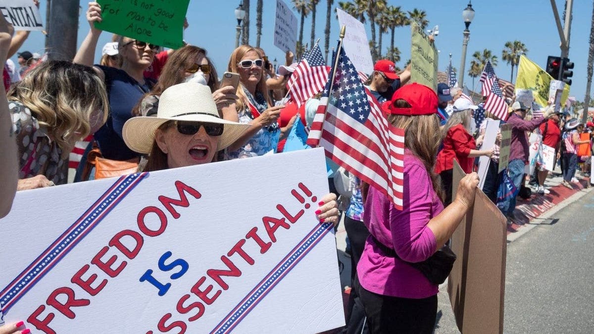 Protestors gather at PCH and Main Street