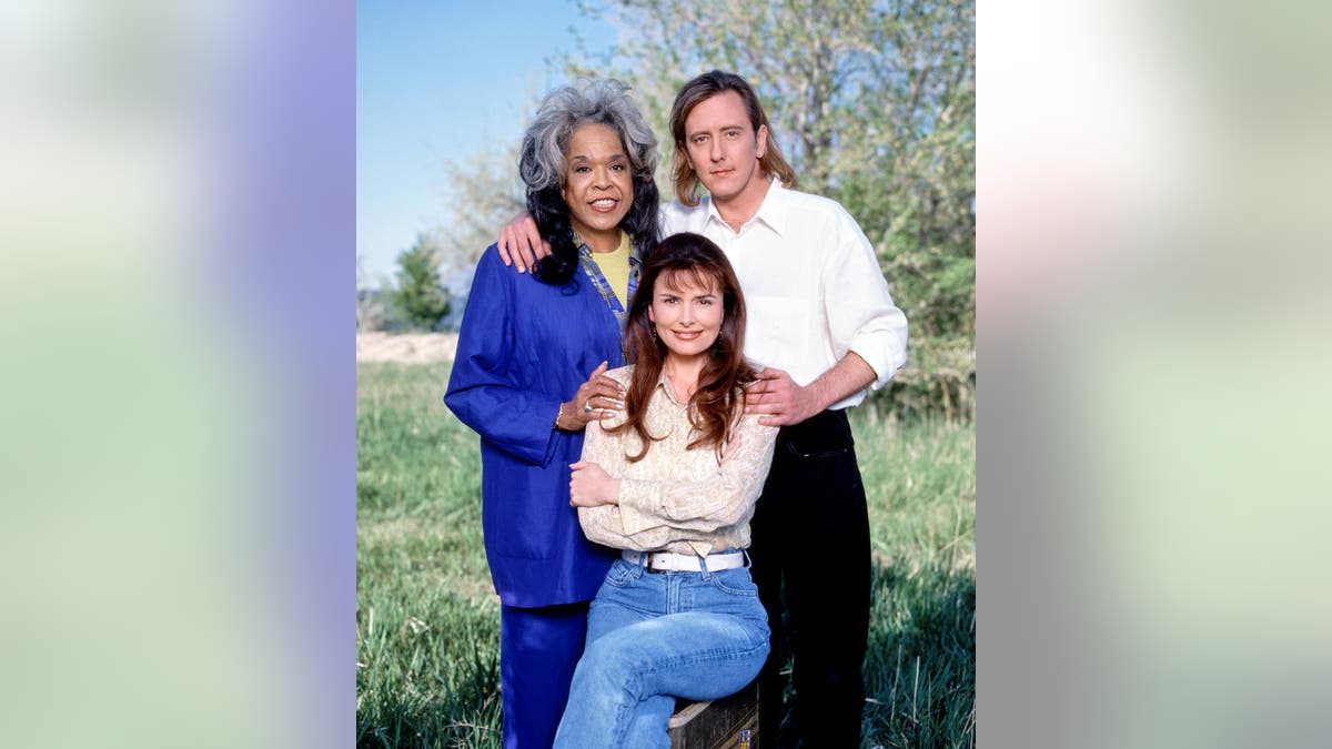 Della Reese in blue, Roma Downey in white shirt, and John Dye in white shirt.