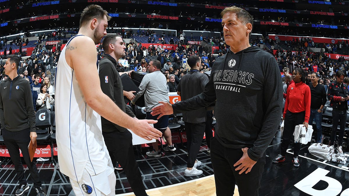 Luka Doncic shakes Mark Cuban's hand