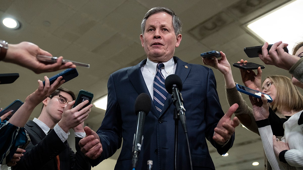 Steve Daines speaking to reporters