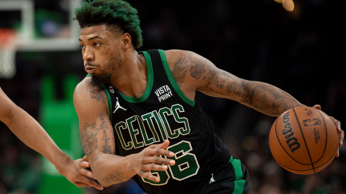 Marcus Smart drives against the Spurs