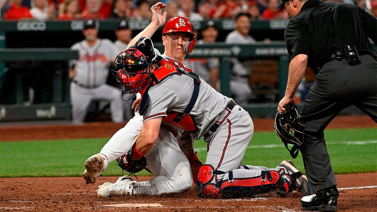 Tyler O'Neill is thrown out at home plate