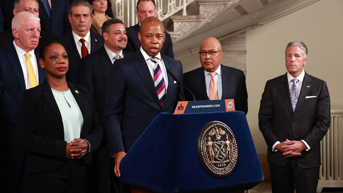 Adams at City Hall press conference with police commissioner