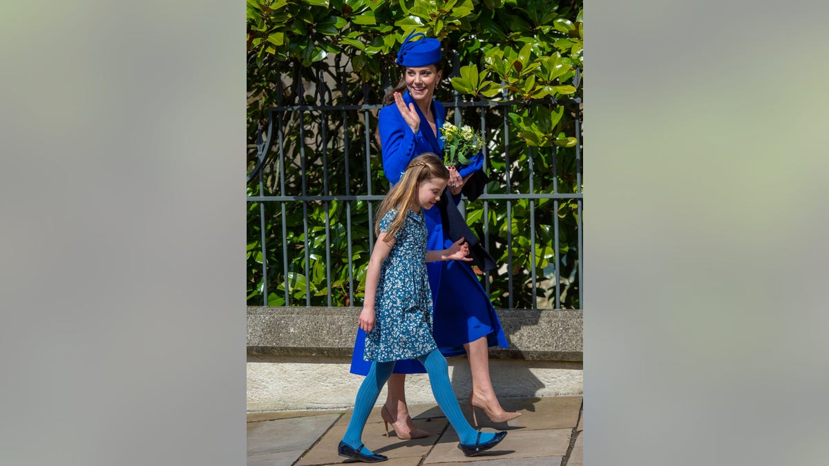 Princess Charlotte in blue floral dress walks to church with Kate Middleton in blue hat and coat dress