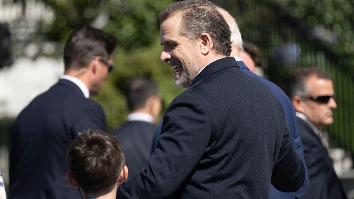 Hunter Biden walks with his father US President Joe Biden