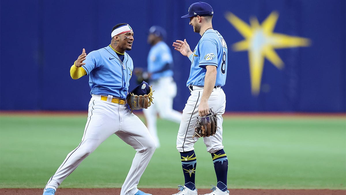 The Rays celebrate beating the Red Sox