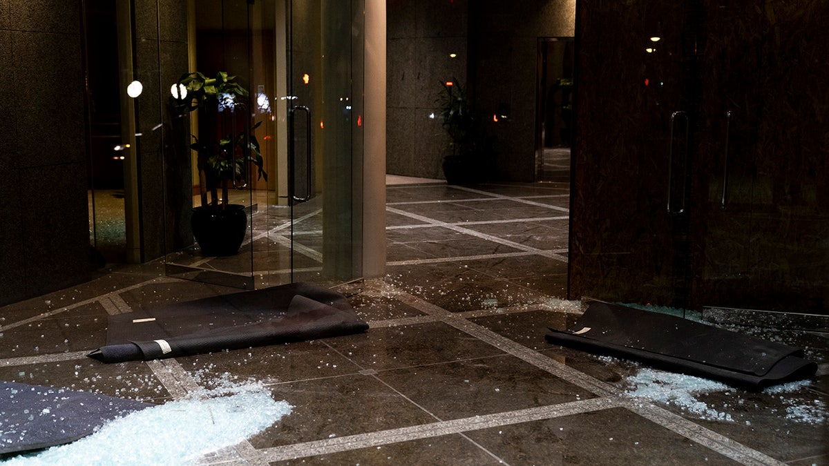 shattered Louisville bank windows