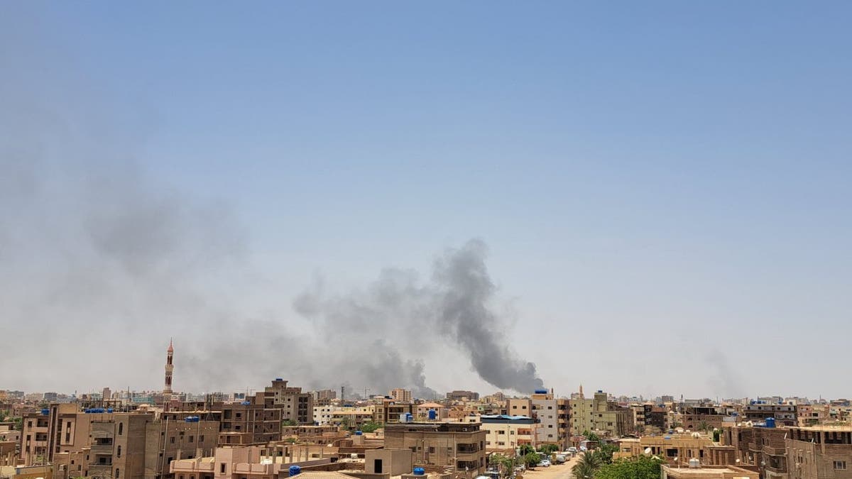 smoke rising out of sudan landscape