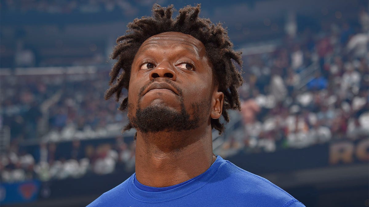 Julius Randle looks on before a playoff game