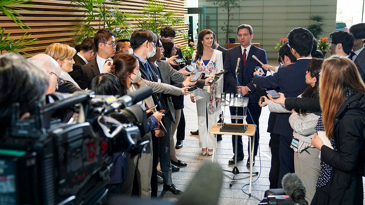 Ron DeSantis with reporters in Japan