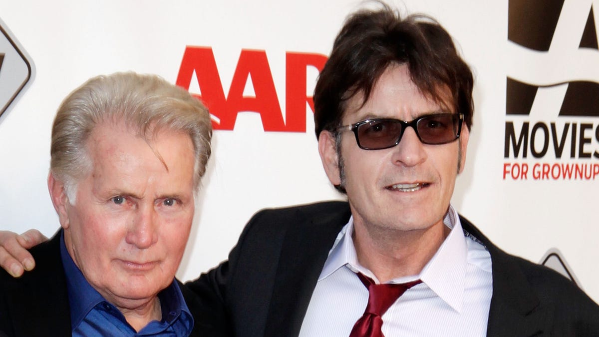 Martin Sheen and Charlie Sheen pose together on the red carpet.