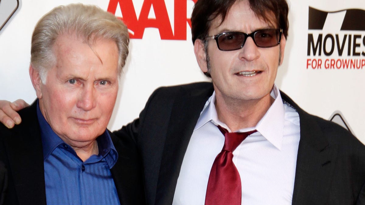 Martin Sheen and Charlie Sheen pose together on the red carpet.