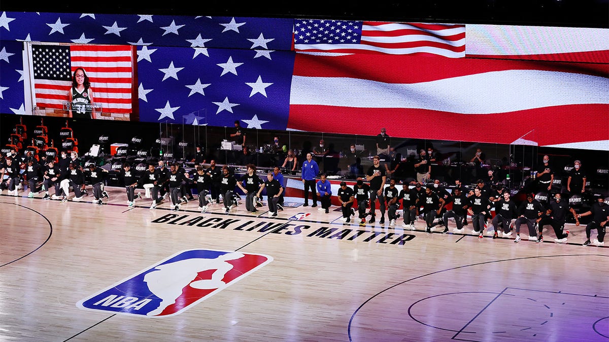Players take a knee during the NBA Bubble