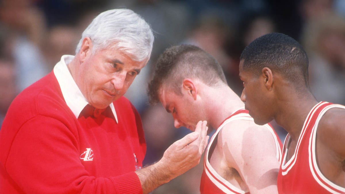 Bob Knight talks to players on the court in 1998