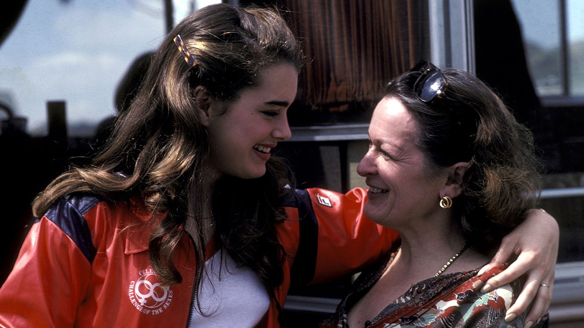Brooke Shields looks down at her mother with her arm wrapped around her shoulder in a photo taken for "Celebrity Challenge of the Stars"
