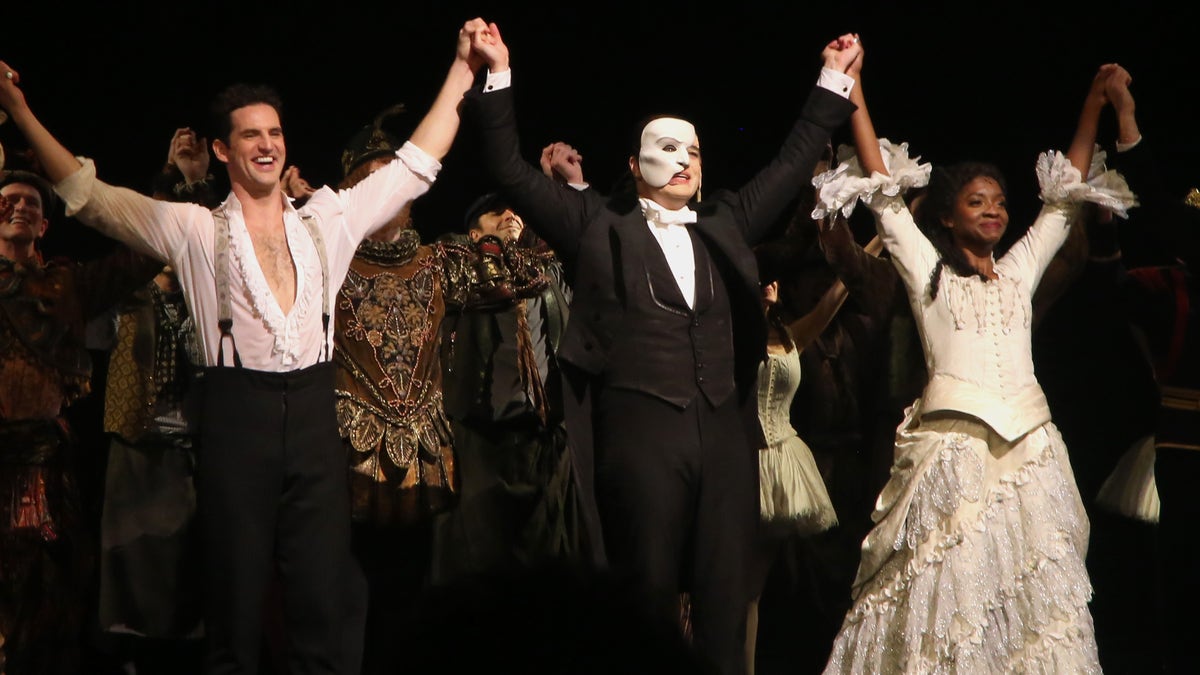 Actors from a 2022 performance of The Phantom of the Opera take a bow