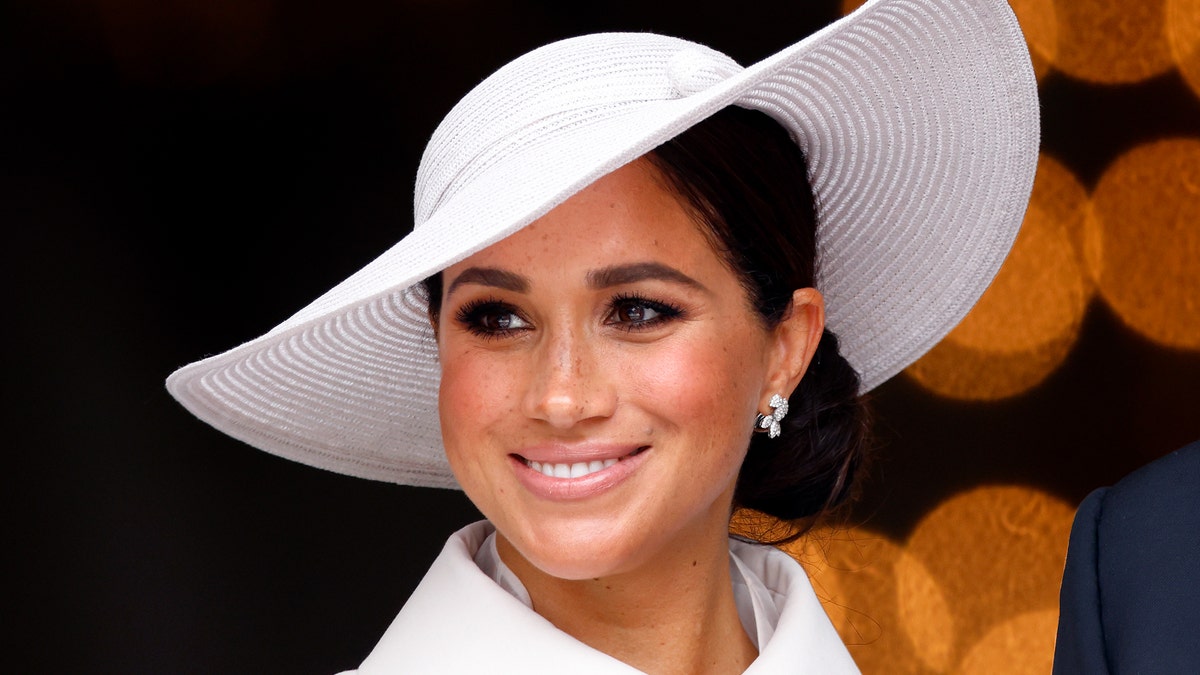 Meghan Markle close up wearing a white hat