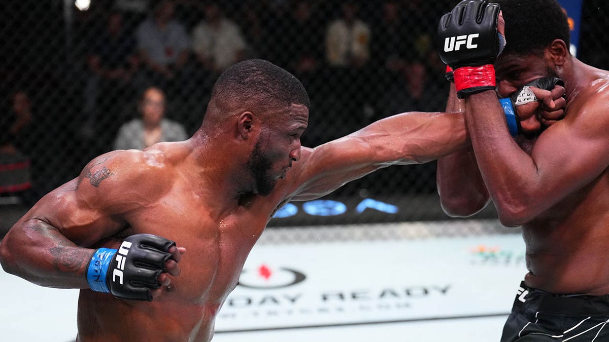 Karl Roberson punches Kennedy Nzechukwu of Nigeria during a July 2022 fight