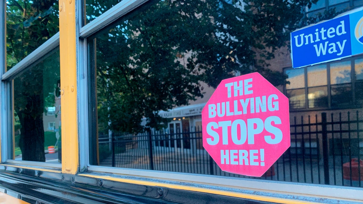 Bully sticker on bus window