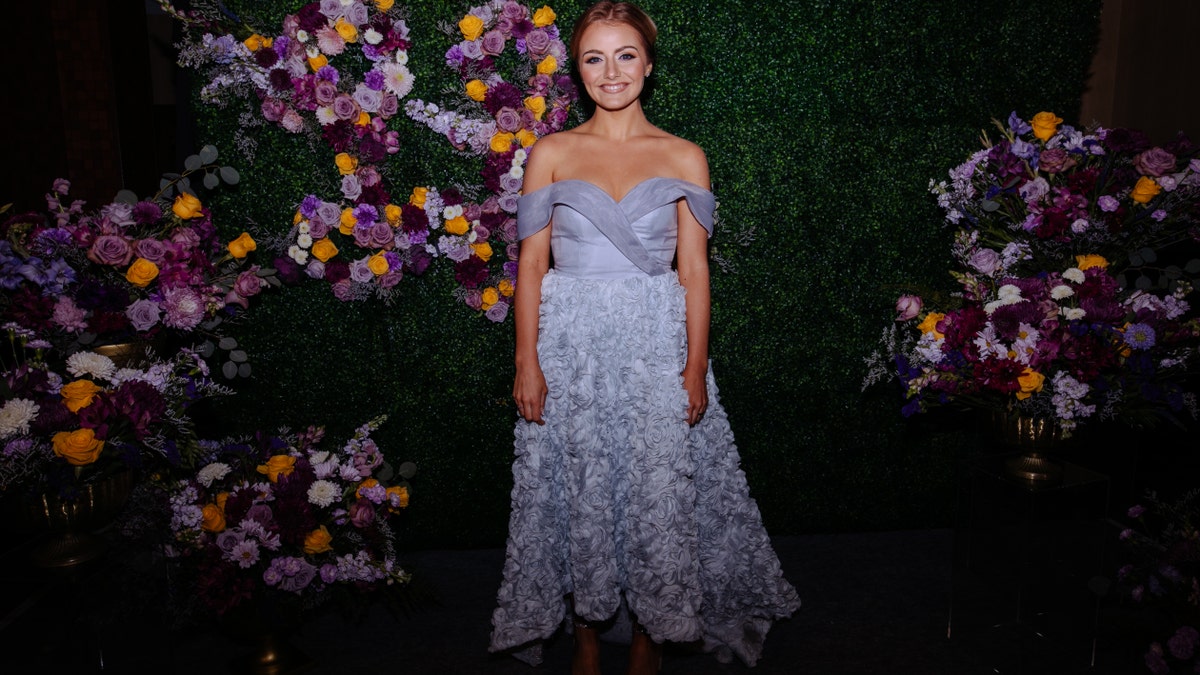 Emmy Russell in a blue dress at Loretta Lynn tribute