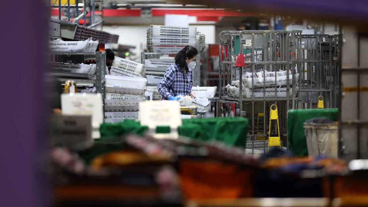 postal worker in processing facility