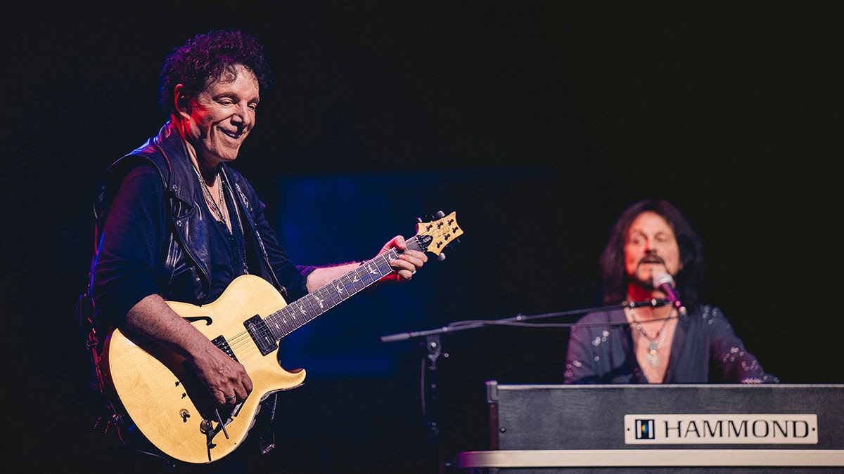 Neal Schon and Gregg Rolie on stage for Journey's 50th anniversary tour