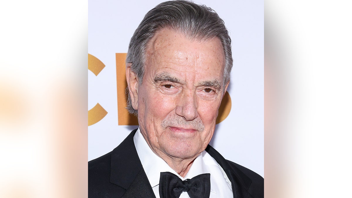 Eric Braeden on the red carpet in a classic black tuxedo with a stern look