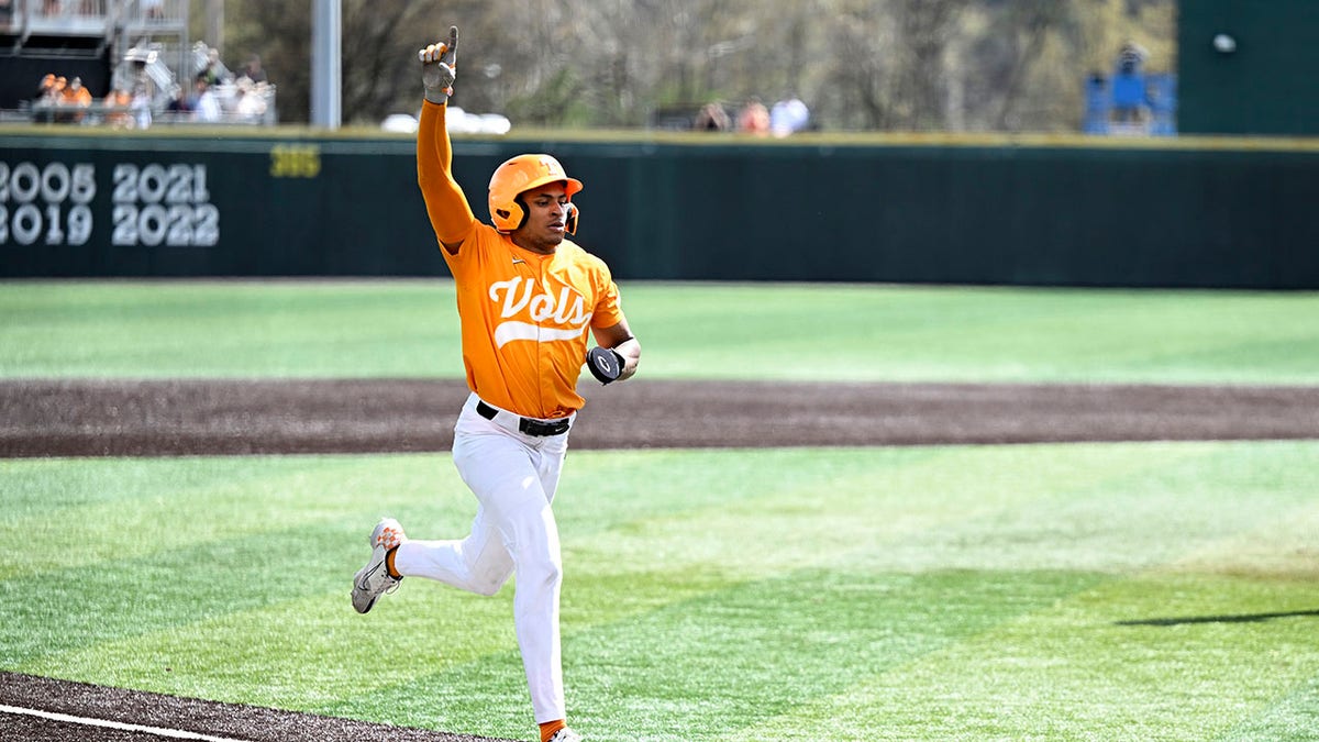 Christian Moore celebrates scoring a winning run