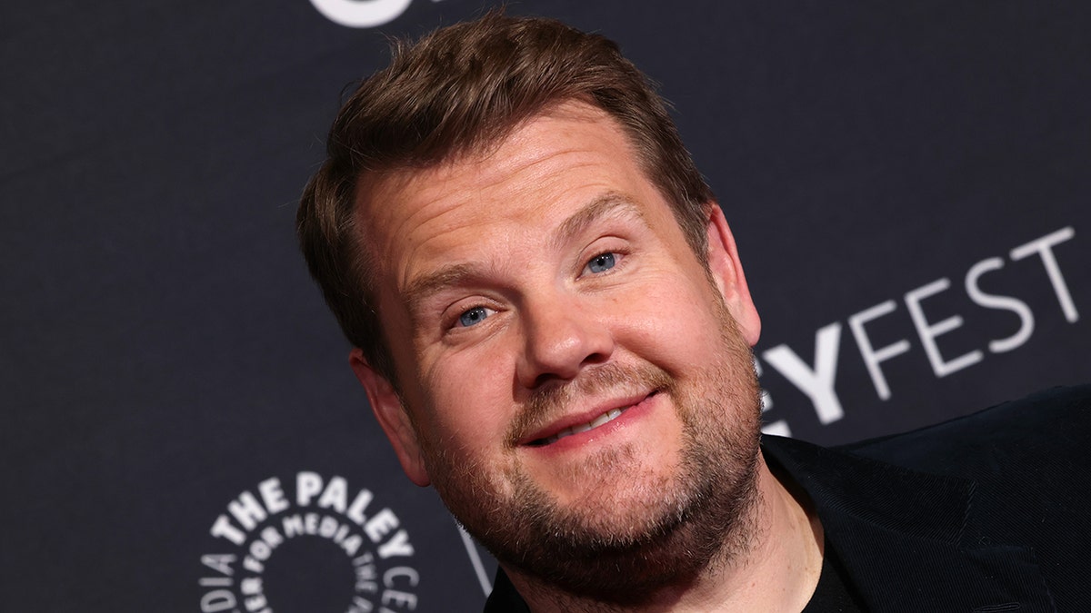 James Corden partially smiles on the red carpet in California for PaleyFest 2023