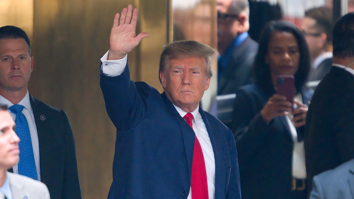 Trump waving