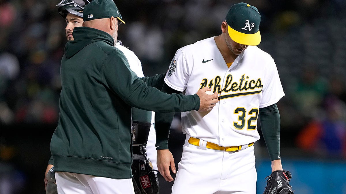 A's manager Mark Kotsay makes a call to the bullpen