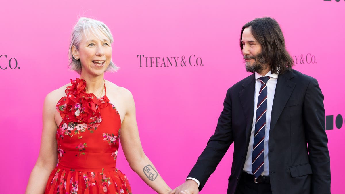 Keanu Reeves Alexandra Grant hold hands