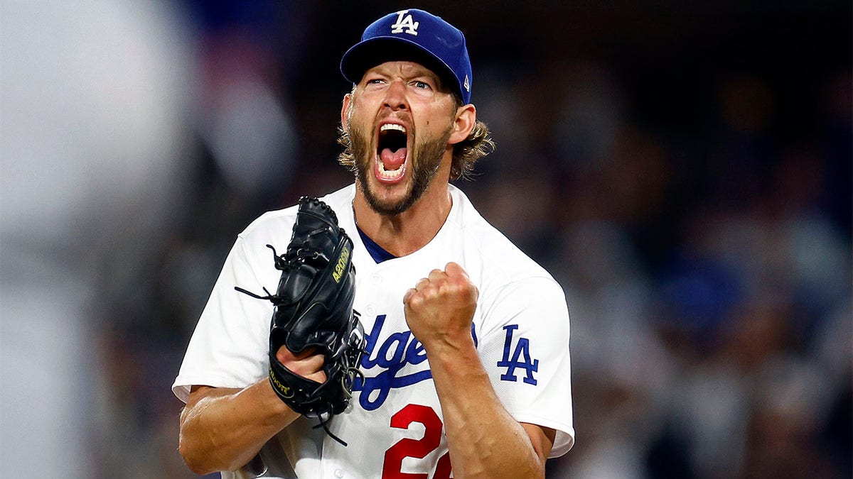 Clayton Kershaw reacts after striking out a batter