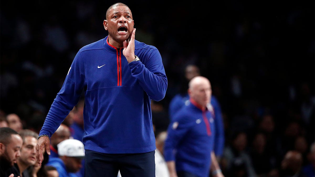 Doc Rivers yells toward his team in the playoffs