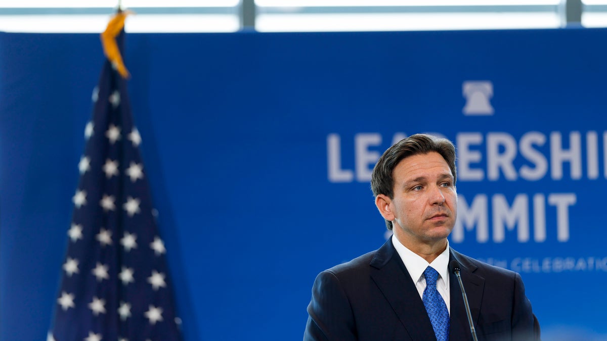 Gov. DeSantis speaking on a stage