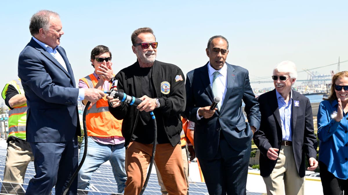 Terry Tamminen, President/CEO of AltaSea and former Governor of California Arnold Schwarzenegger, energize the 4-acre solar rooftop of the AltaSea warehouse at the Port of Los Angeles