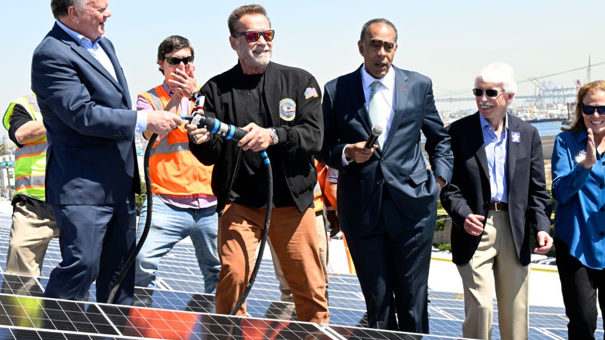 Terry Tamminen, President/CEO of AltaSea and former Governor of California Arnold Schwarzenegger, energize the 4-acre solar rooftop of the AltaSea warehouse at the Port of Los Angeles