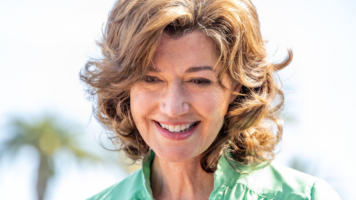 amy grant smiling at earth day event