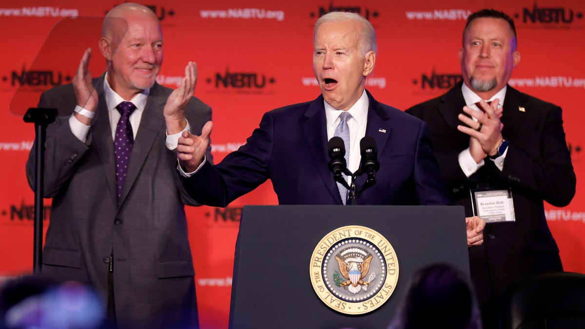 WASHINGTON, DC - APRIL 25: U.S. President Joe Biden (C) is welcomed to the stage by North America's Building Trades Unions President Sean McGarvey (L) and Secretary-Treasurer Brandon Bish during their legislative conference at the Washington Hilton on April 25, 2023 in Washington, DC. Earlier in the day, Biden released a video where he officially announced his re-election campaign. (Photo by Chip Somodevilla/Getty Images)